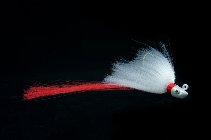 Snook Slayer with White Head, White Body and Red Tail. This Gulfstream Lures jig is great as a Snook Jig, Snook Lure, Tarpon Jig, Tarpon Lure, Cobia Jig, Cobia Lure, Striped Bass Jig, Striped Bass lure. Saltwater lures, Saltwater jigs.